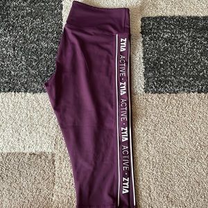 Crop length (17”) Zyia logo leggings. Plum Light N Tight.